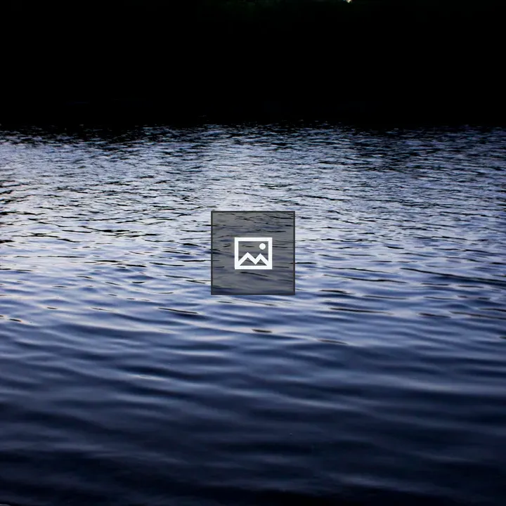 Serene water surface at dusk