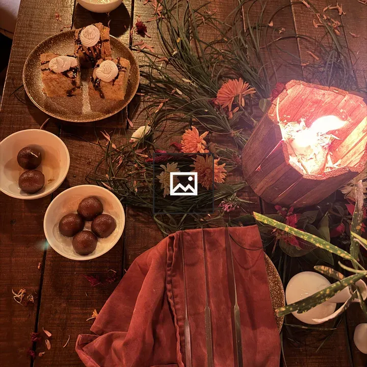 Rustic table with sweets and lantern