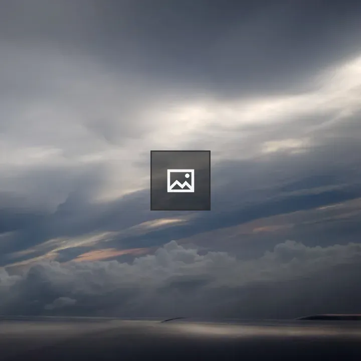 Cloudy sky over calm landscape