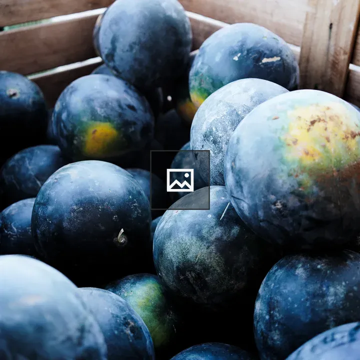 Crate of black watermelons