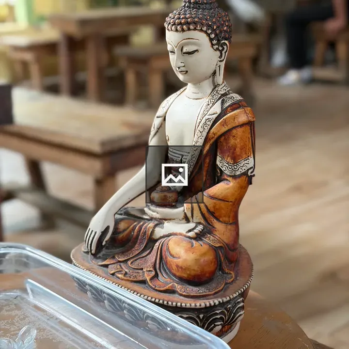 Buddha statue in orange robes