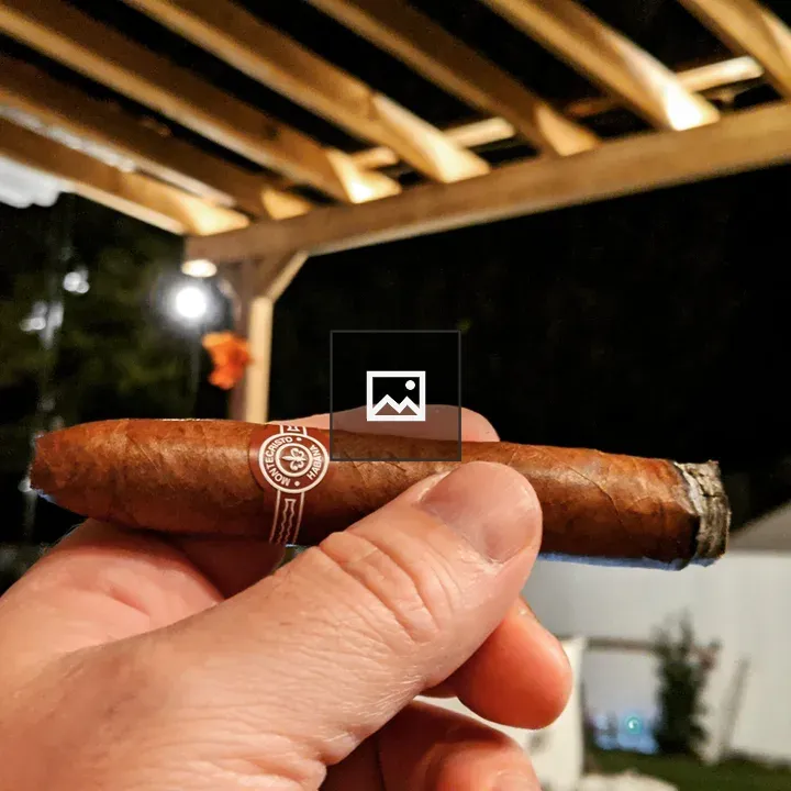 Monte Cristo cigar in hand