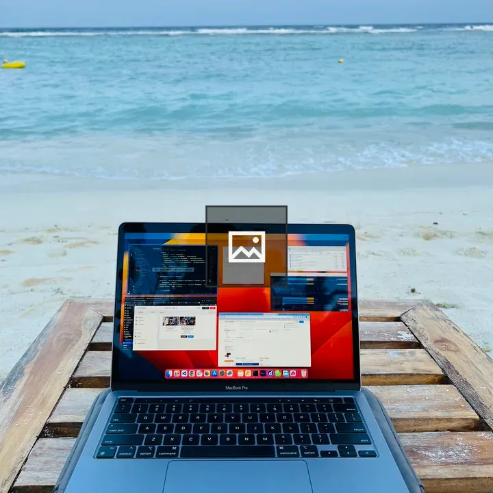 Laptop on wooden beach table