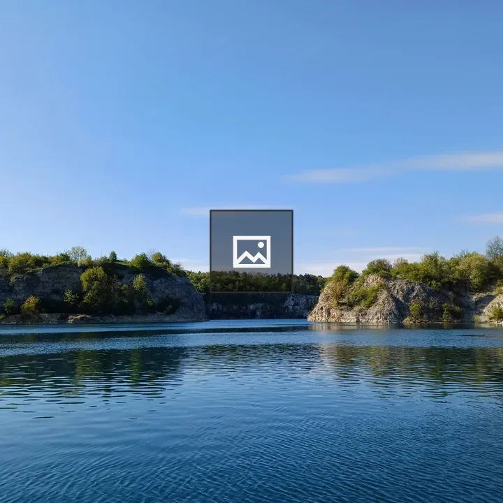 Flooded limestone quarry shoreline