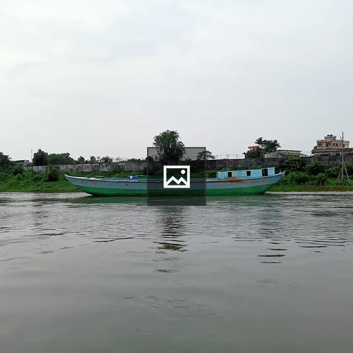 Green Wooden Boat on River