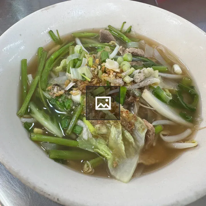 Thai noodle soup with greens and sprouts