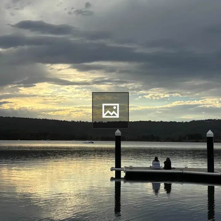 Two girls on a wooden dock