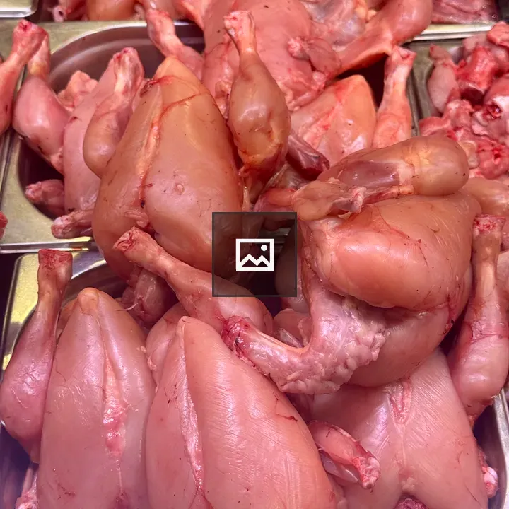 Display of raw chickens in trays