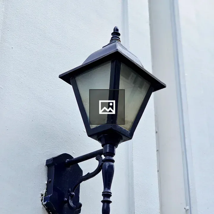 Wall-mounted lantern on white wall