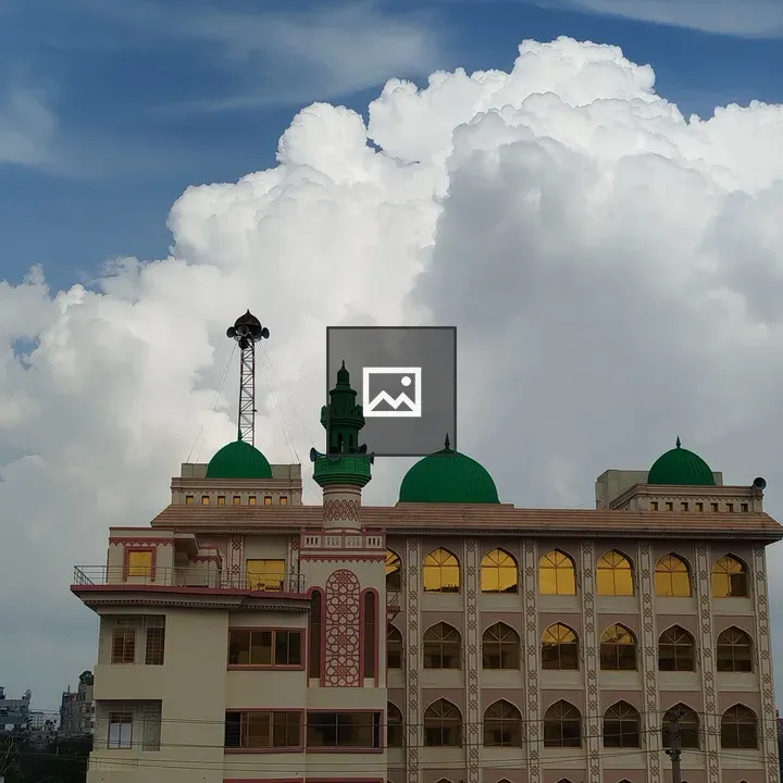 Multi-story Mosque with Green Domes