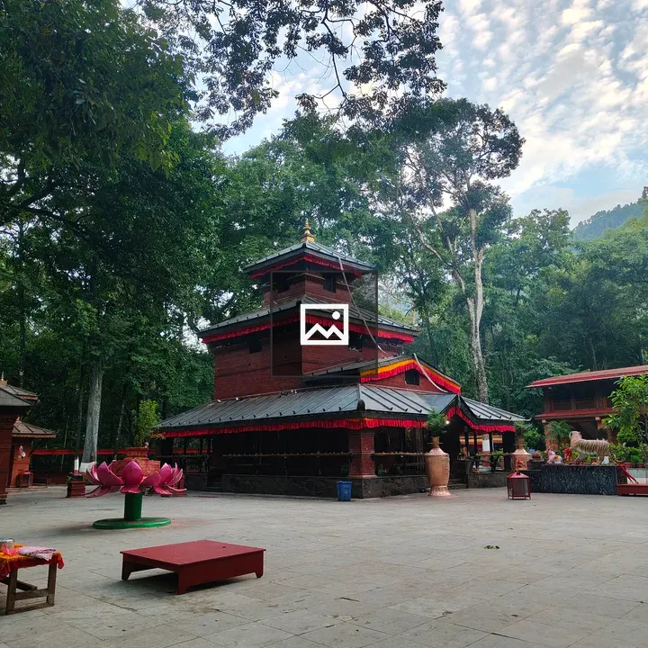 Temple with red walls and lotus sculpture