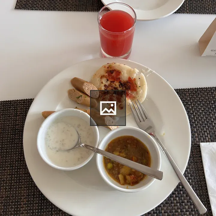 Dosa on White Plate with Sambar and Yogurt