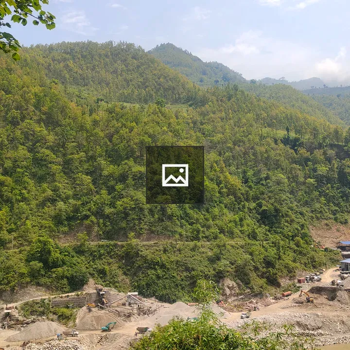 Hill and Riverbank with Machinery