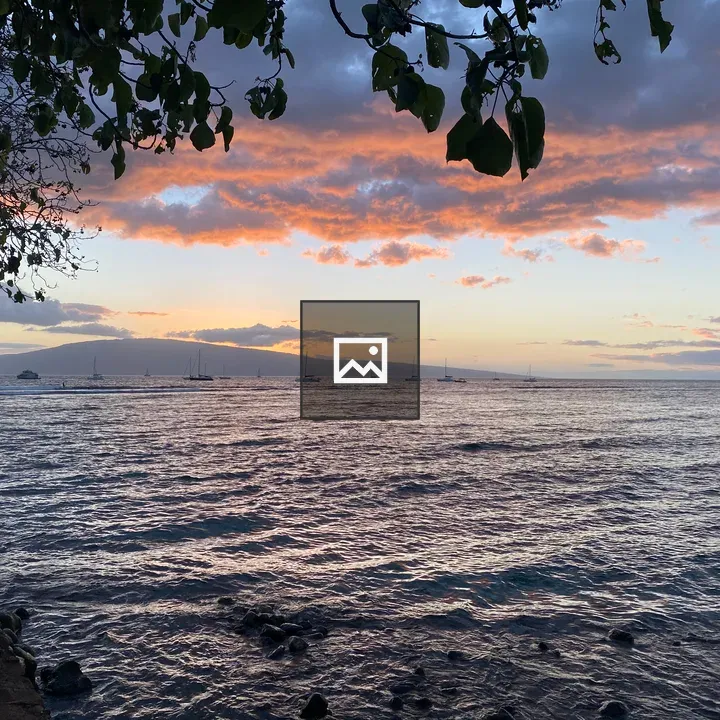 Coastal Sunset with Boats and Rocks