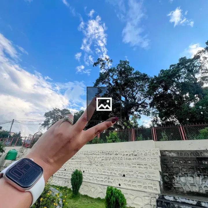 Hand with Peace Sign and Watch