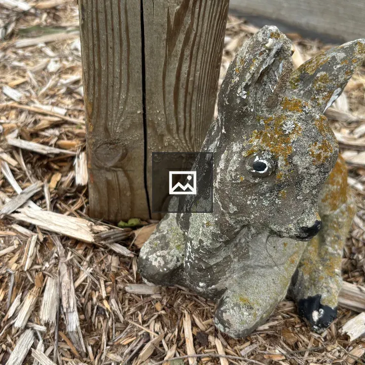Weathered fawn figurine