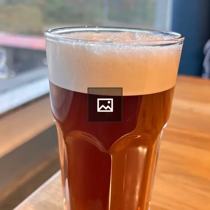 Beer in a Glass on Wood Table