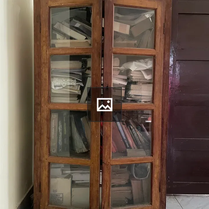 Old cupboard filled with books