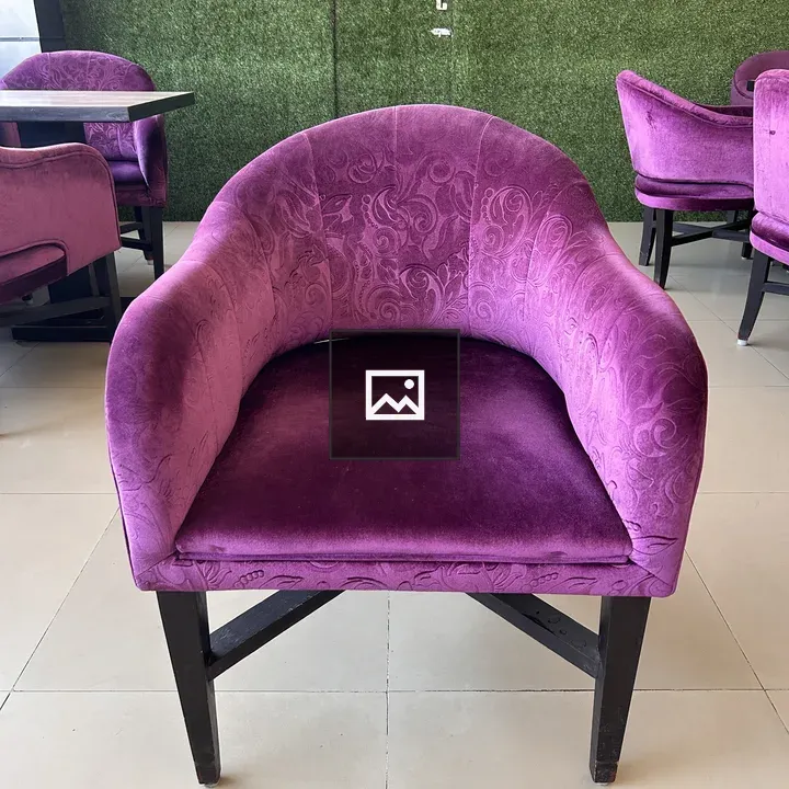 Purple floral armchair indoors