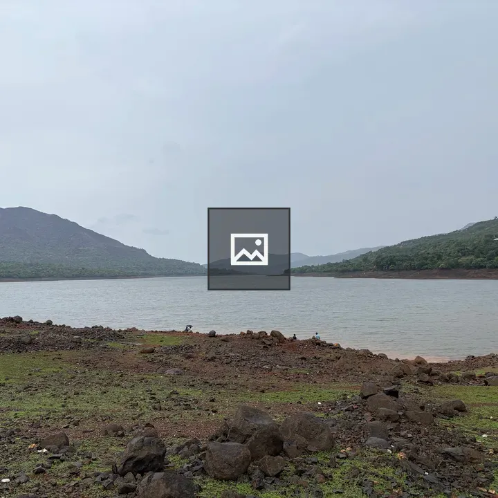 Lake amid mountains in rainy weather