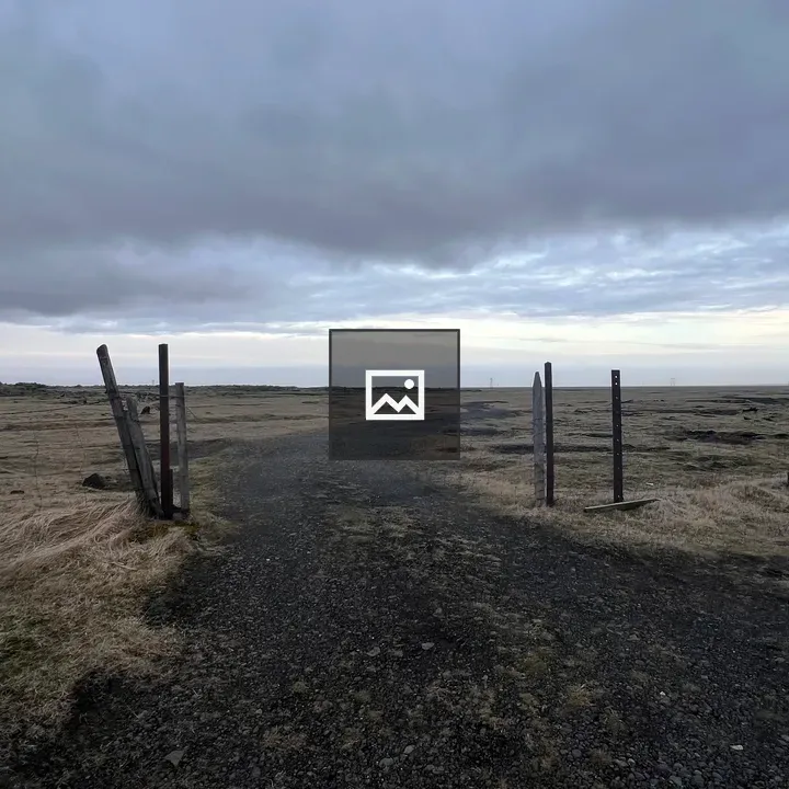 Dirt Road by Fence and Waterfall