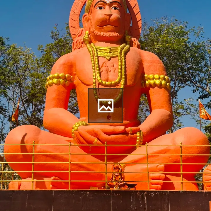 Hanuman statue in orange pose