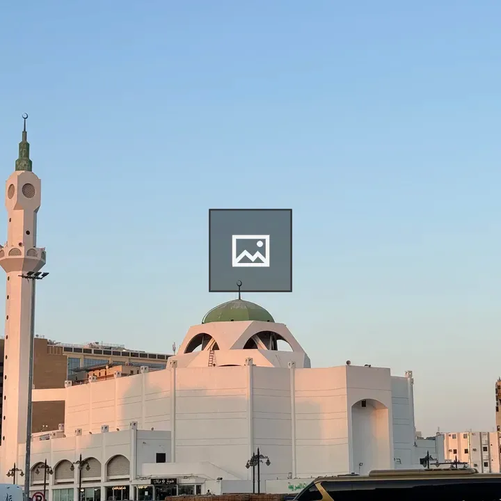 White mosque with tall minaret