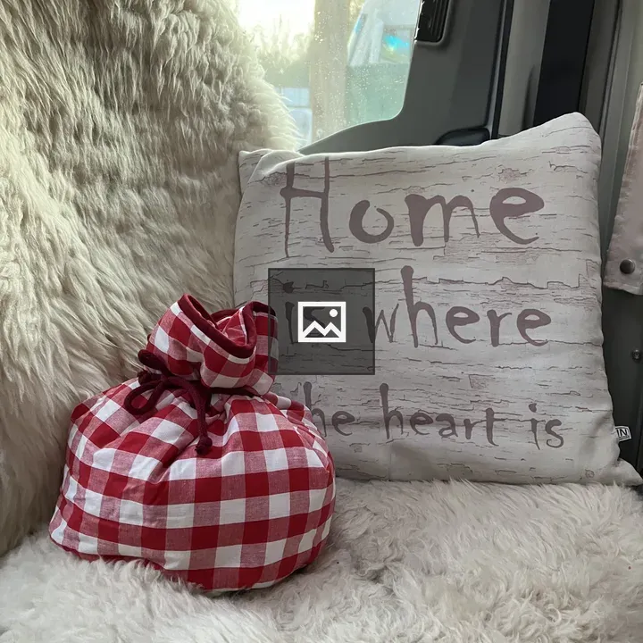 Red gingham pouch on blanket