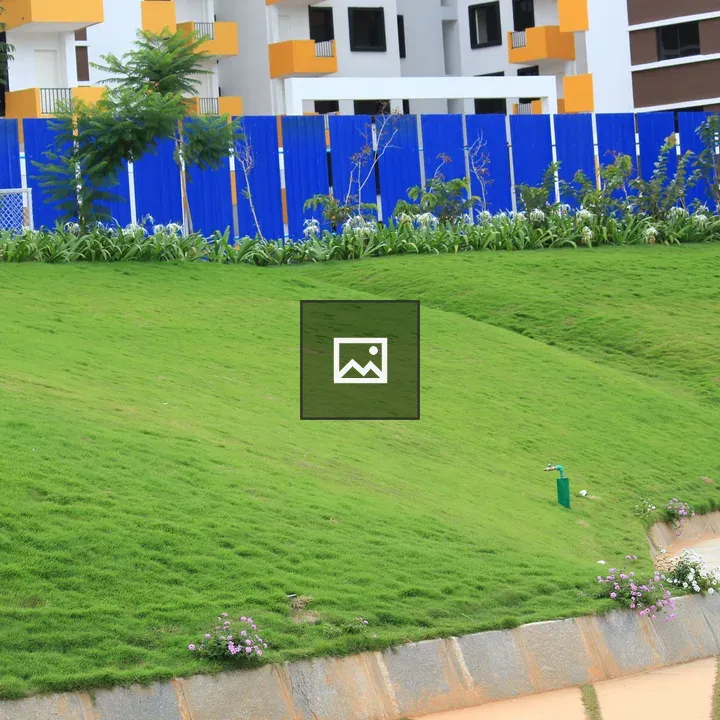 Green lawn in front of apartment complex