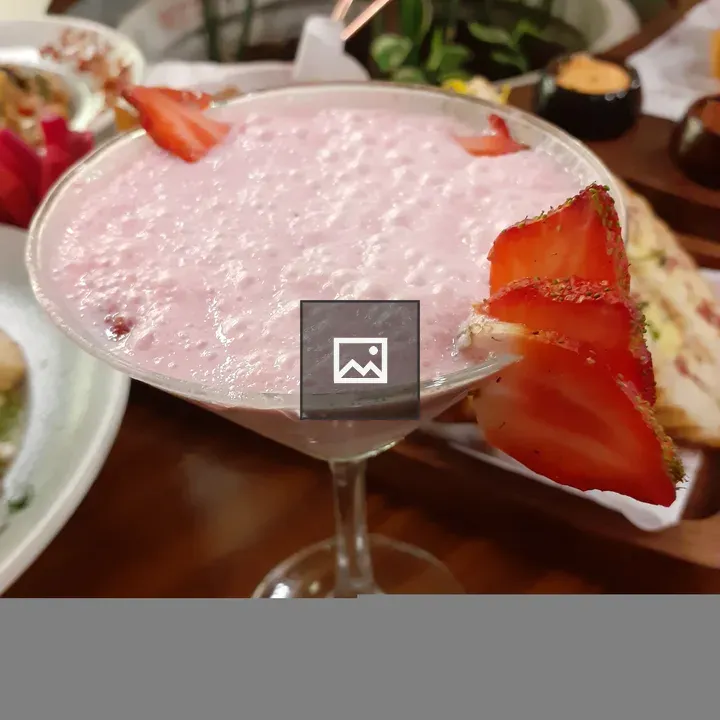 Pink mocktail with strawberries