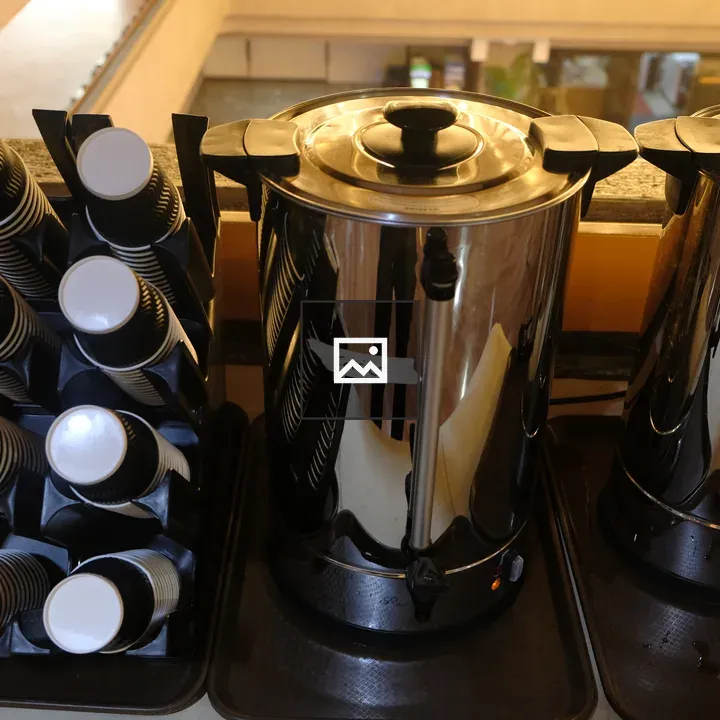 Coffee station with urns and cups