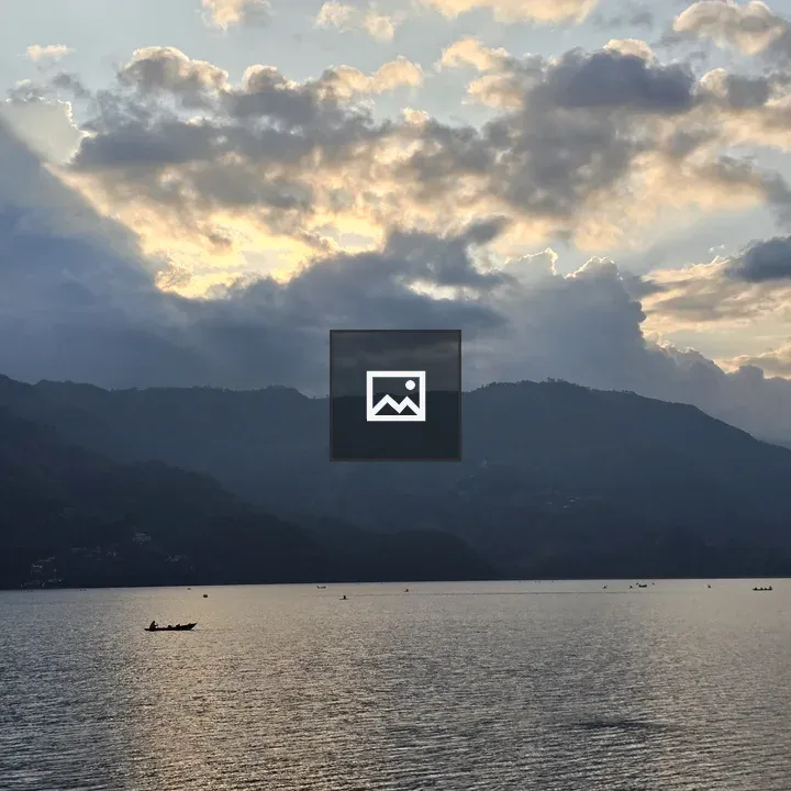 Serene Lake Sunset With Boats