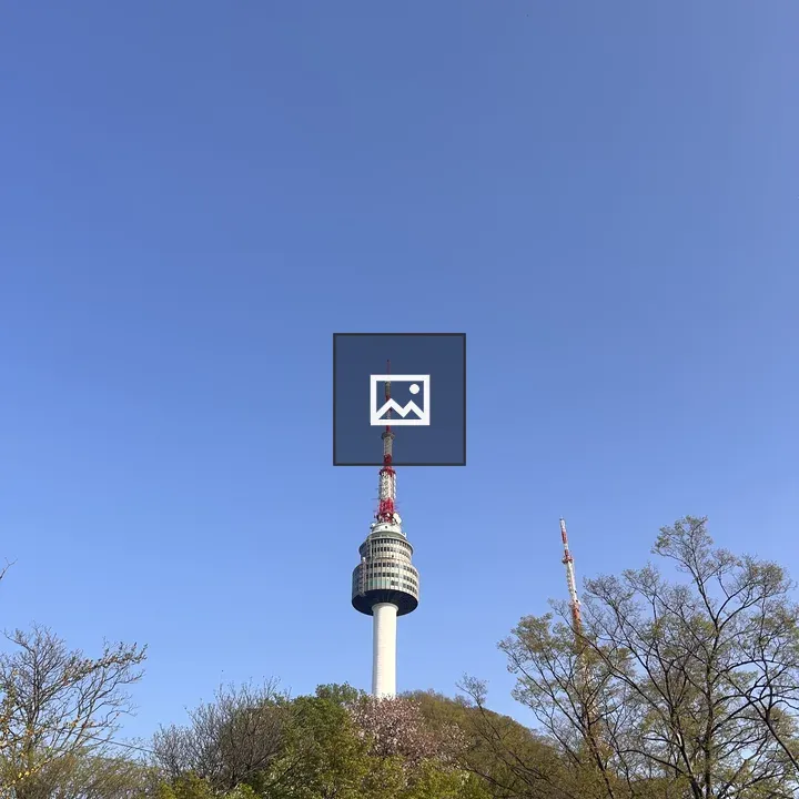 Communications tower above trees