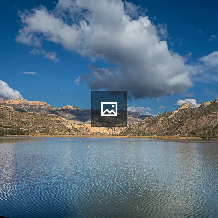 Lake with mountains and clouds