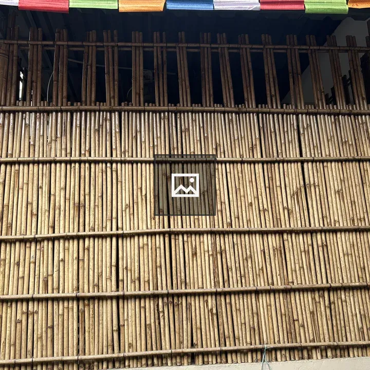 Bamboo Fence with Prayer Flags