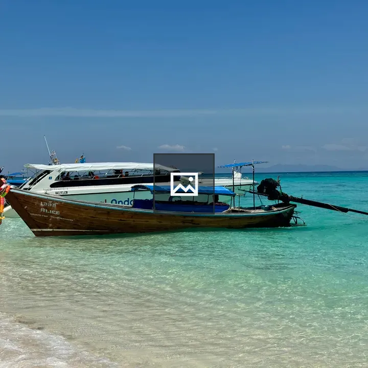 Longtail boat by the shore