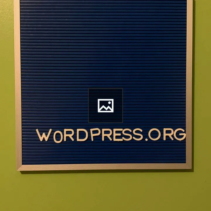 Green wall with blue WordPress board