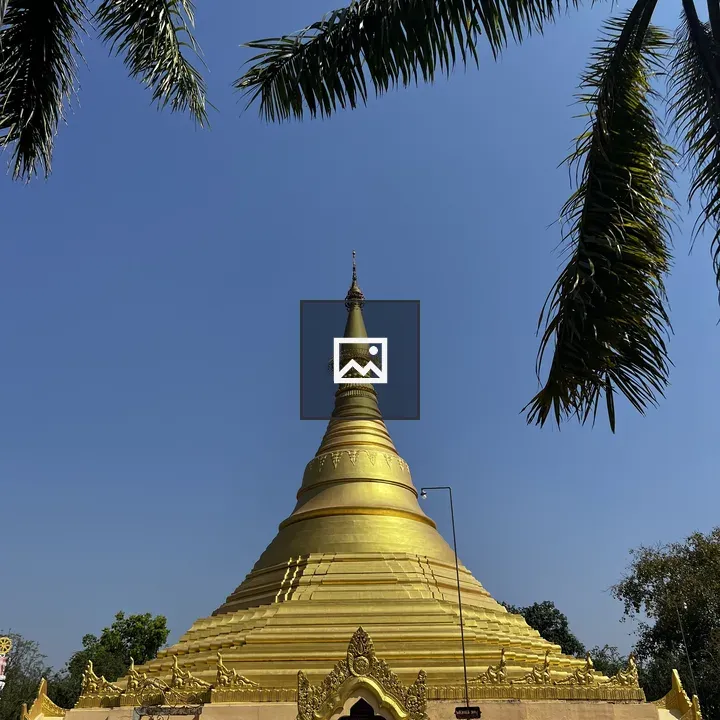 Golden stupa with palm fronds
