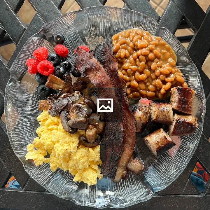 Breakfast plate with mixed berries and eggs