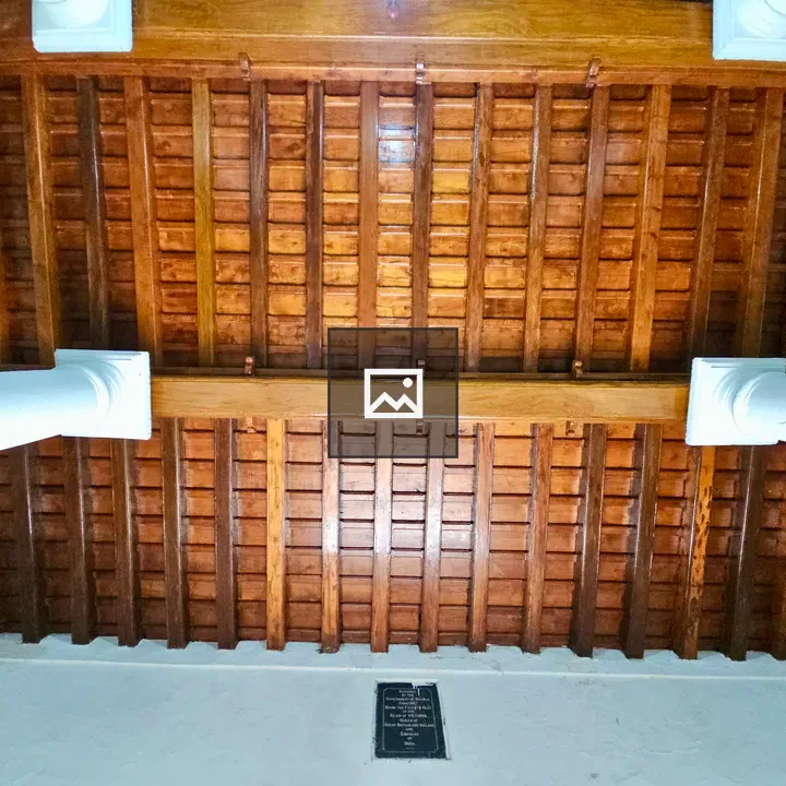 Polished wooden ceiling and columns