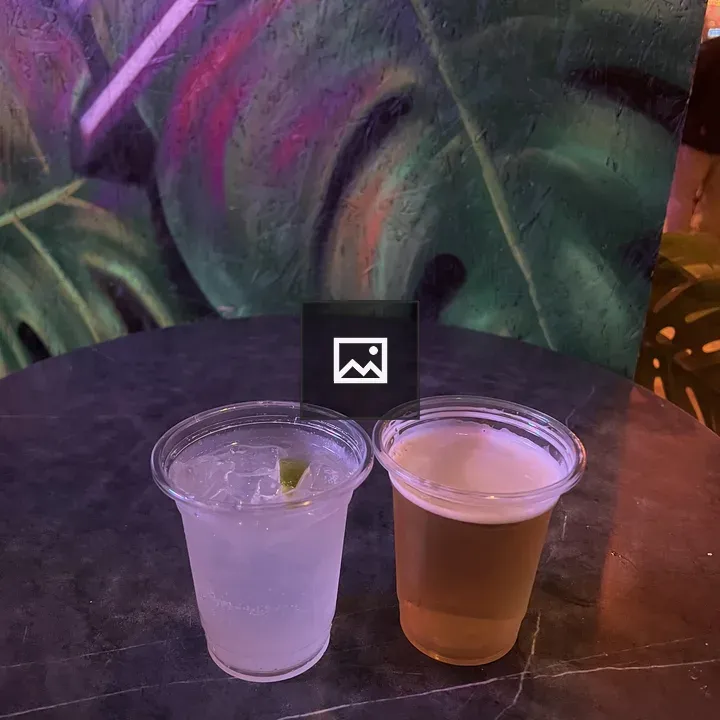 Two Clear Cups with Drinks