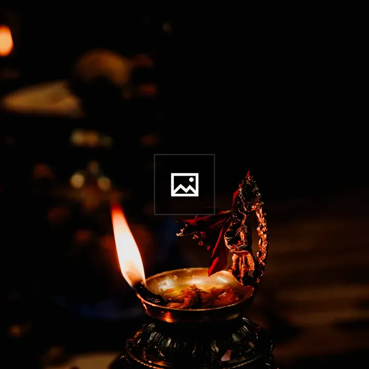 A glowing oil lamp