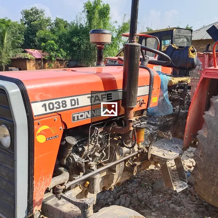 Parked tractor on dirt surface
