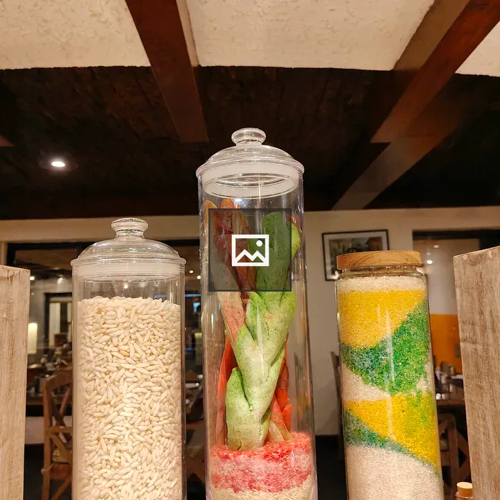 Glass jars with colorful grains