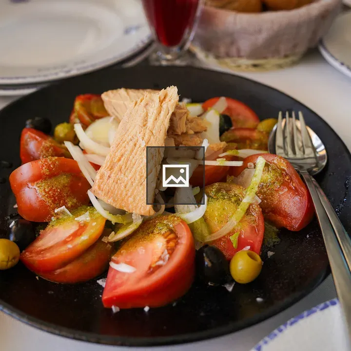 Salad with tomatoes, olives, and tuna