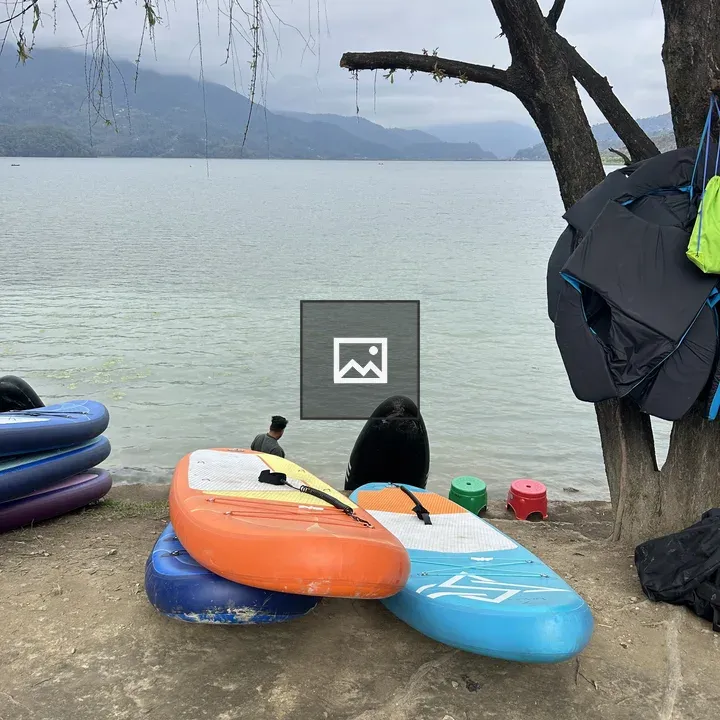 Kayaks by the Lake Shore