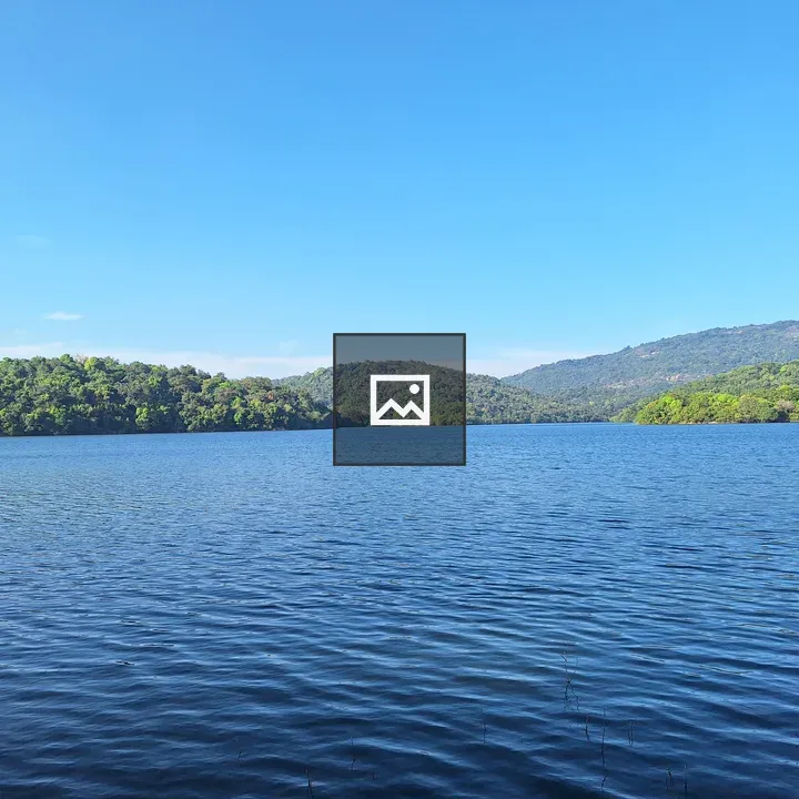 Serene waterway with green hills