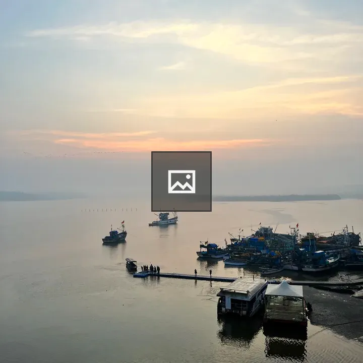 Sunrise Over Goa Boats
