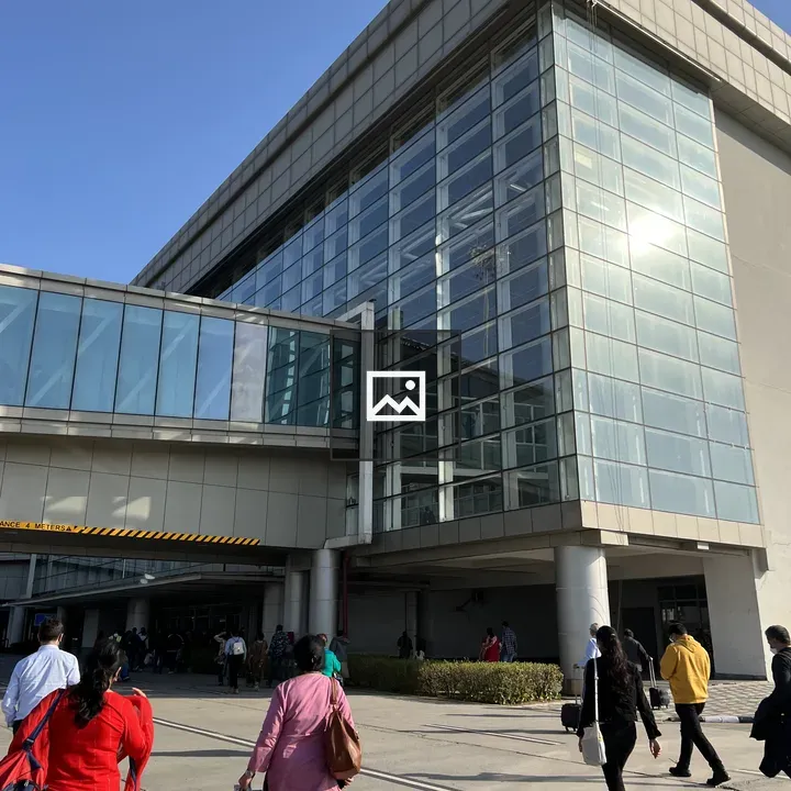 People Walking to Glass Building