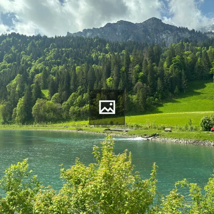 Vibrant lake landscape with mountain backdrop
